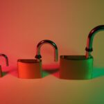 two green padlock on pink surface